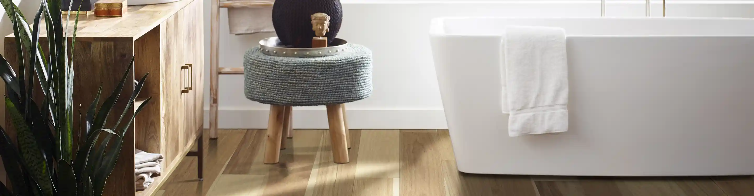 Bathroom with waterproof floors and a tub